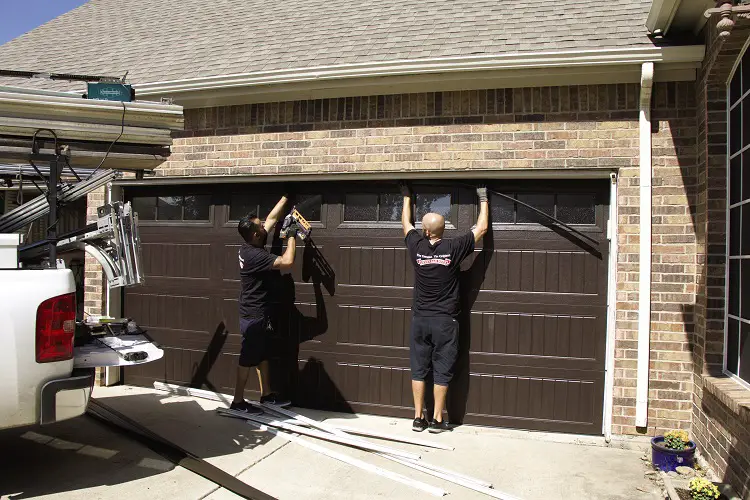 garage door experts installing a door